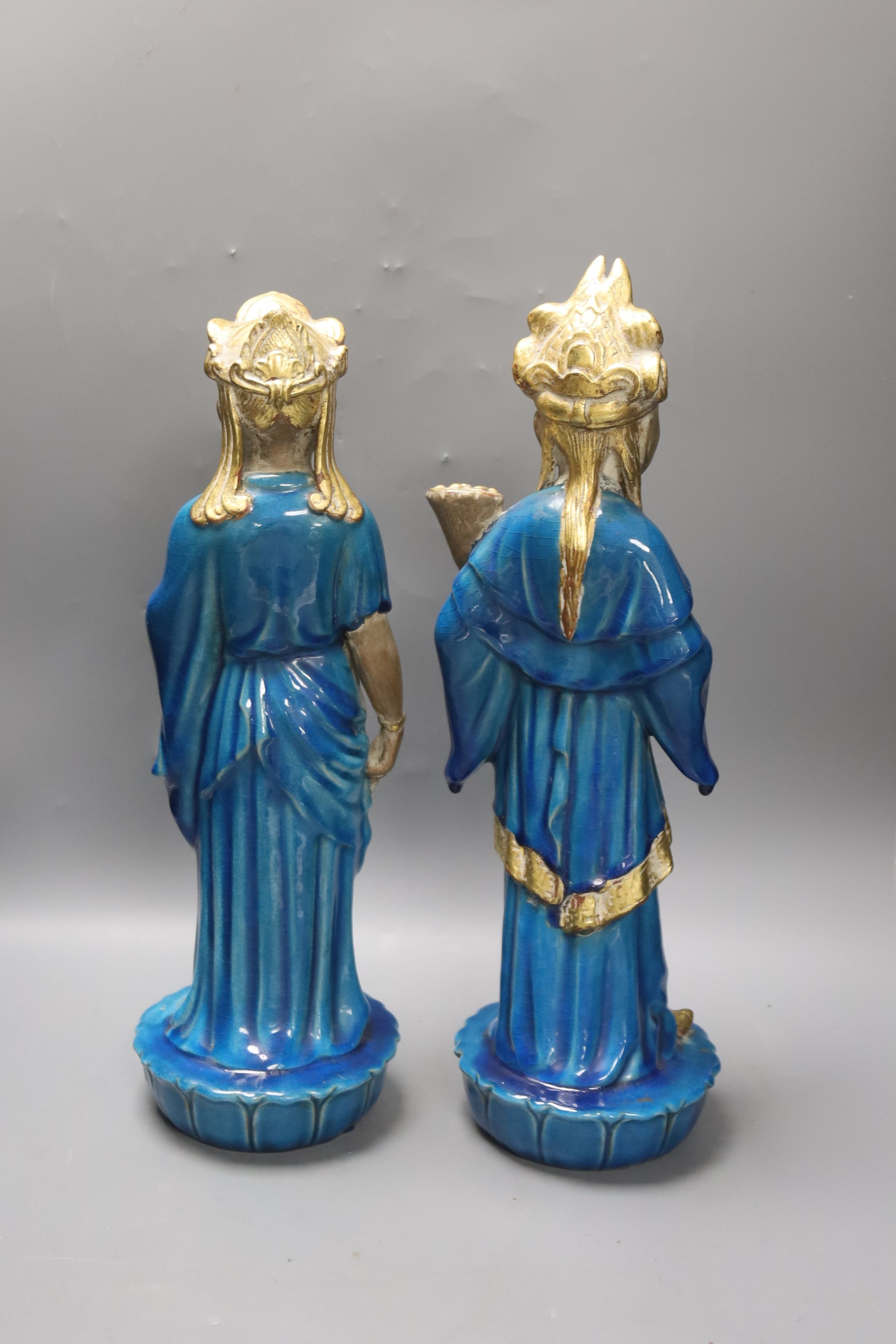 Ugo Urbano Zaccagnini, Florence, Italy, a pair of gilded turquoise glazed ceramic Oriental figures, circa 1950's, signed to base, 44cm high